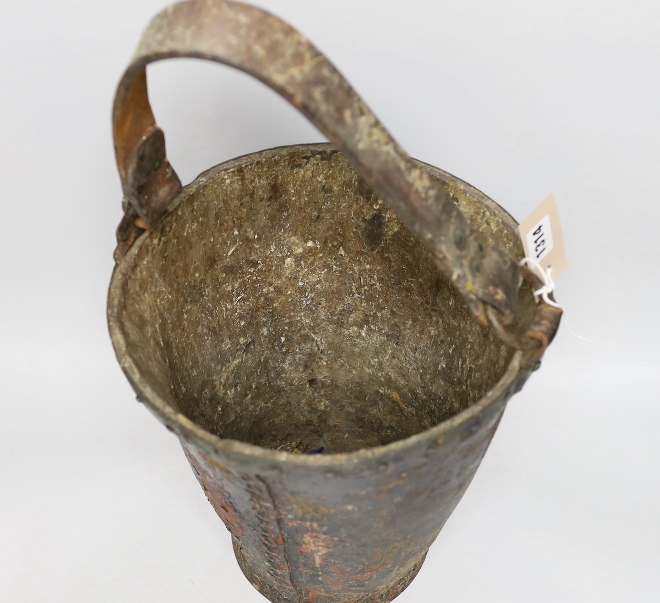 A Victorian leather bound coat of arms fire bucket, bucket 30cms high (not including handle)